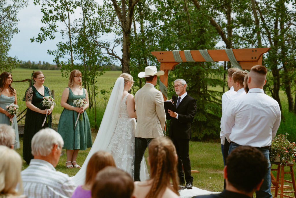 Groom and Bride stand at alter
