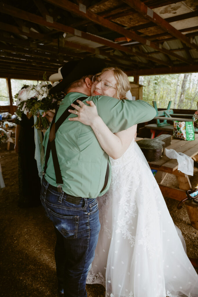 Bride hugs guest 