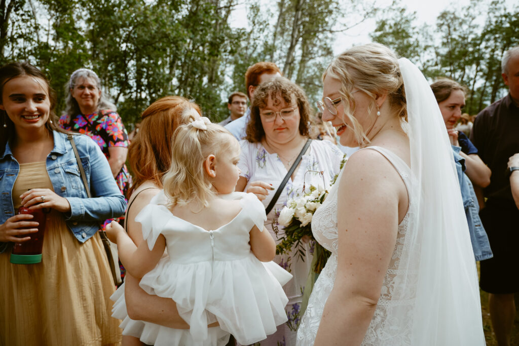 bride talks to wedding guest after wedding