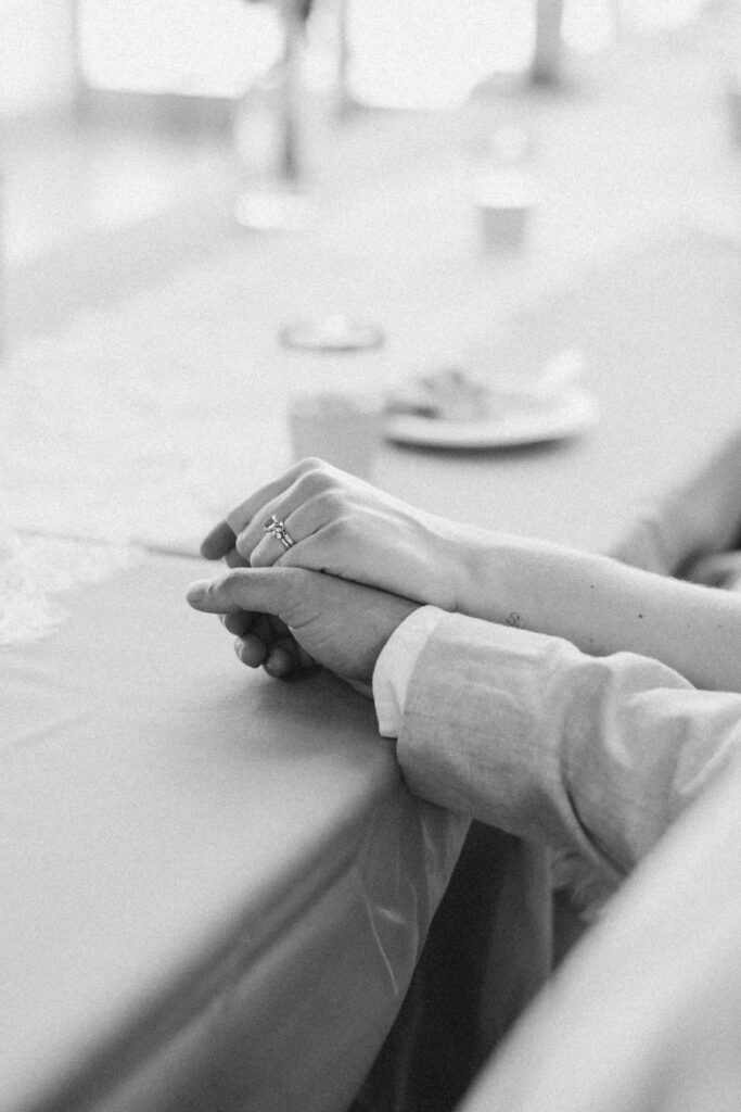 Groom and bride hold hands