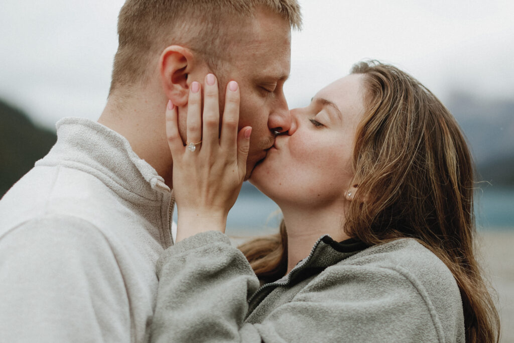 Couple kisses, engagement photo