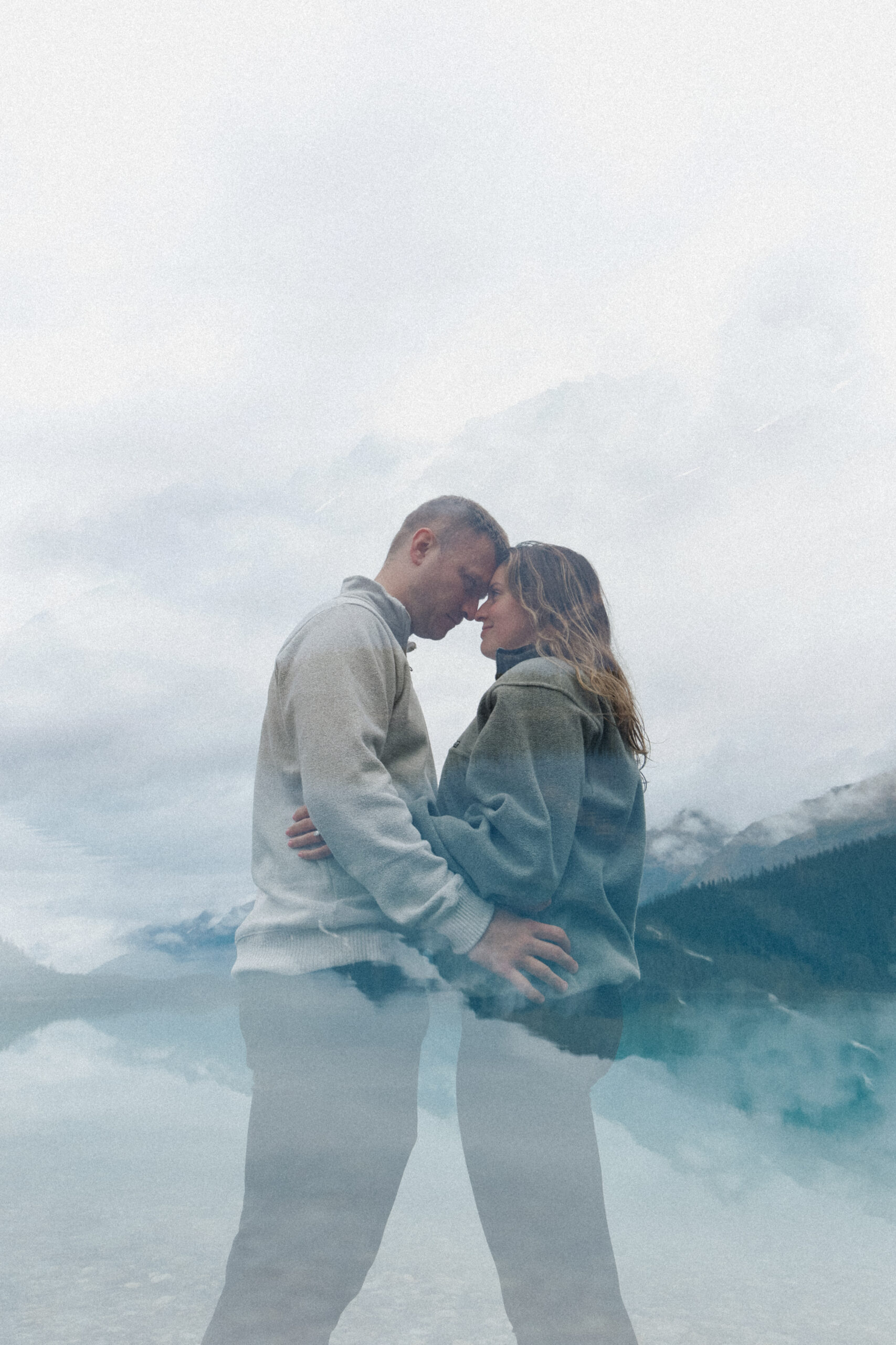 Edited photo. Couple hugging and mountain scenery blend together. 