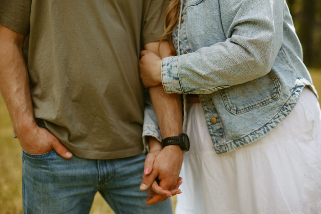 close up on couple holding hands 
