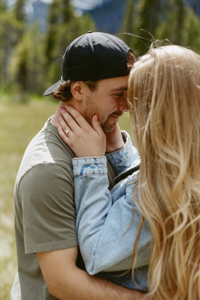 couples poses with foreheads close together. 