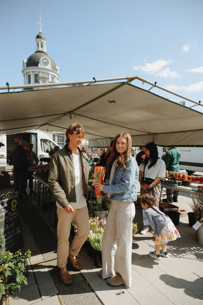 Couple shops at flower market in Kingston, ON
