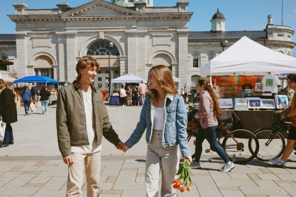 Couple shops for tulips in Kingston, ON Springer Market Square.