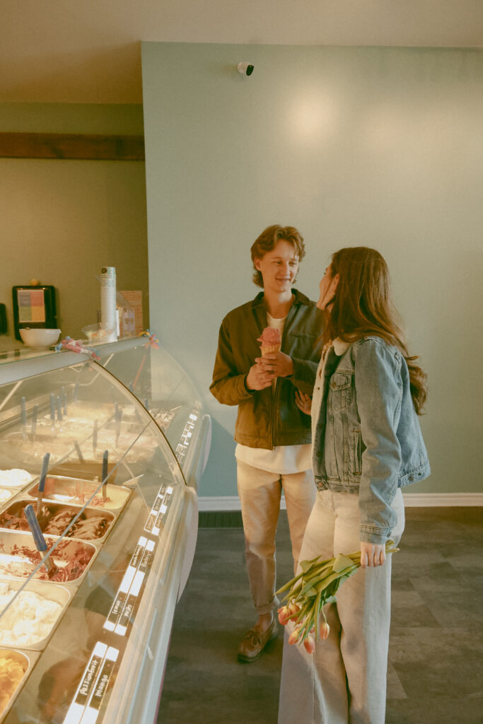 Couple stands in an ice cream shop