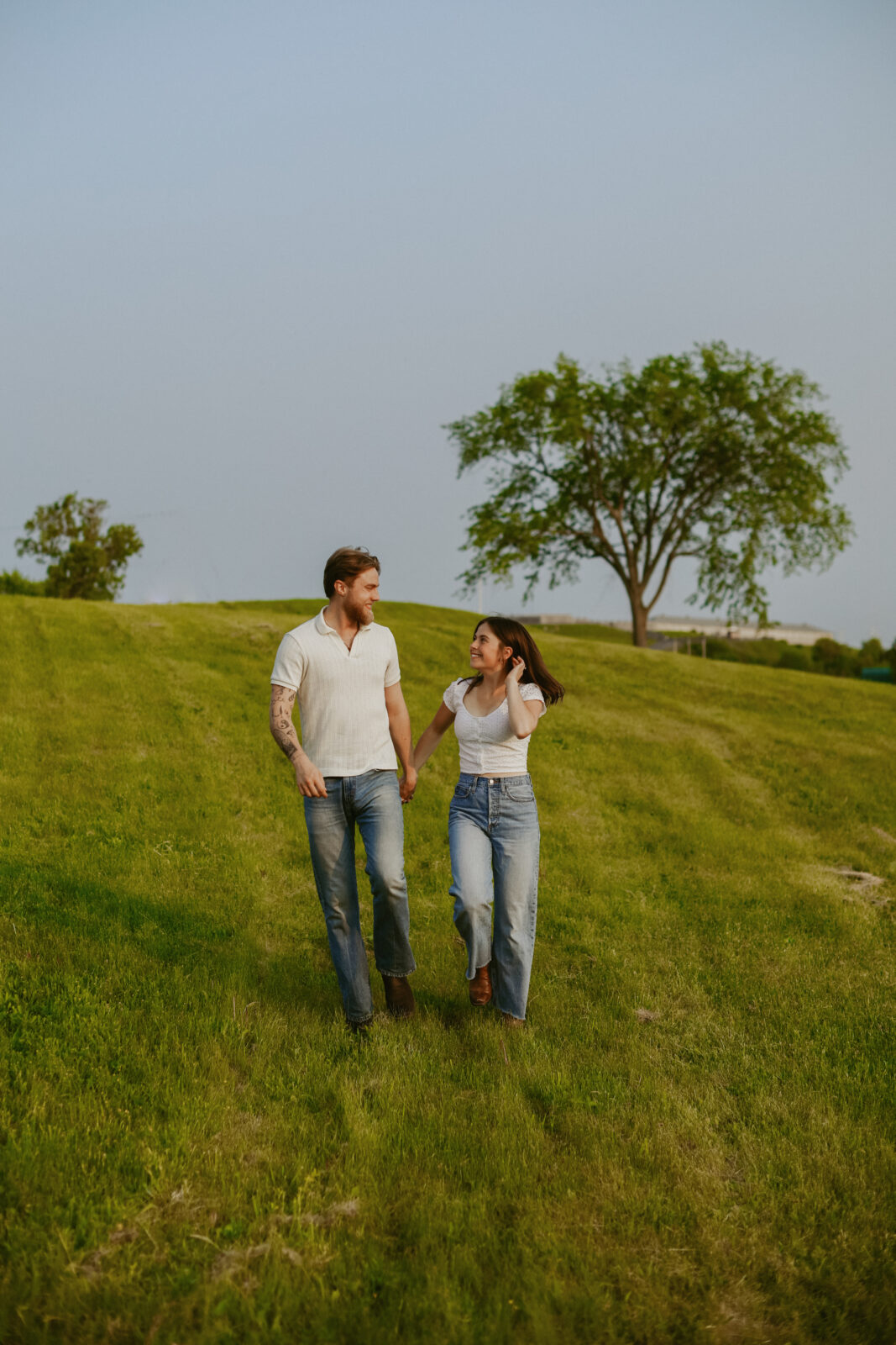 Couple holds hands. Engagement photography. 