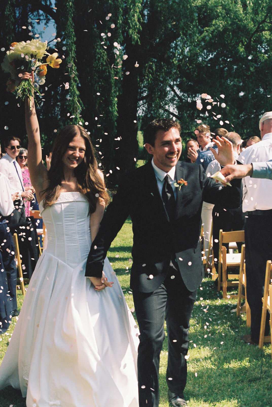 bride and groom walk down the aisle