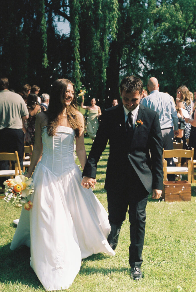 bride and groom walk down the aisle