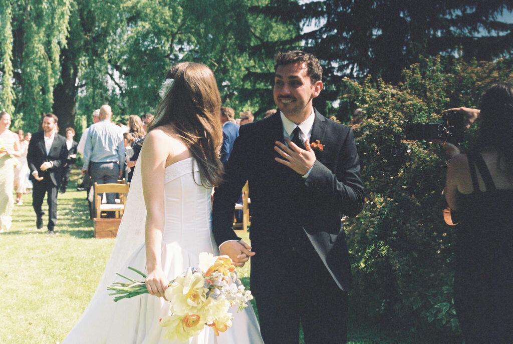 bride and groom walk down the aisle