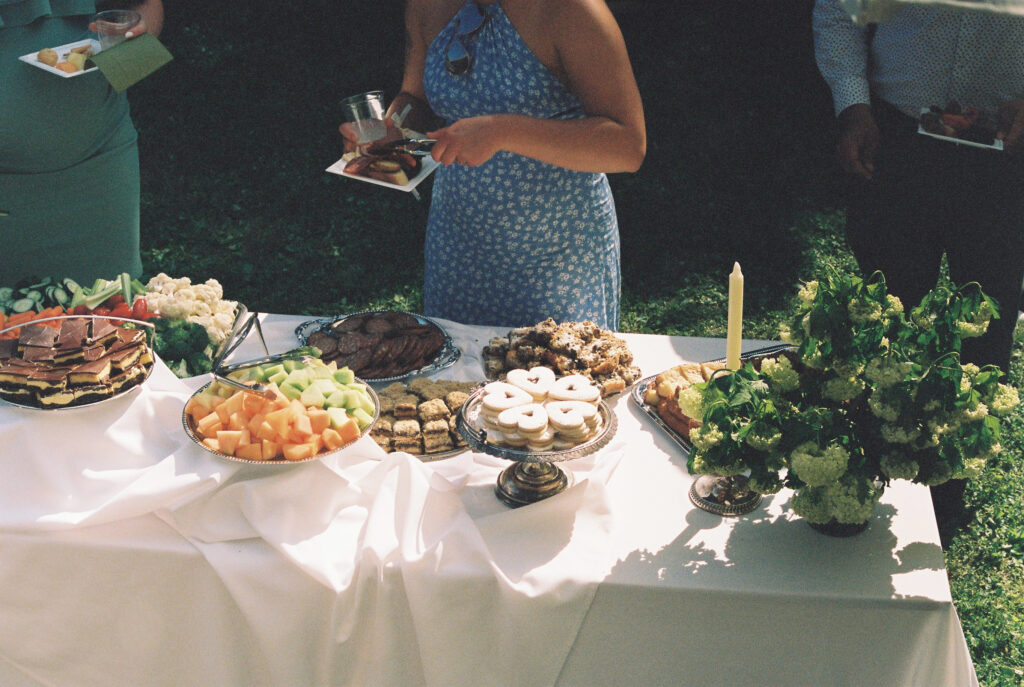 Guest help themselves to deserts at a wedding