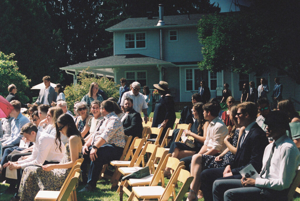guest seat themselves at wedding