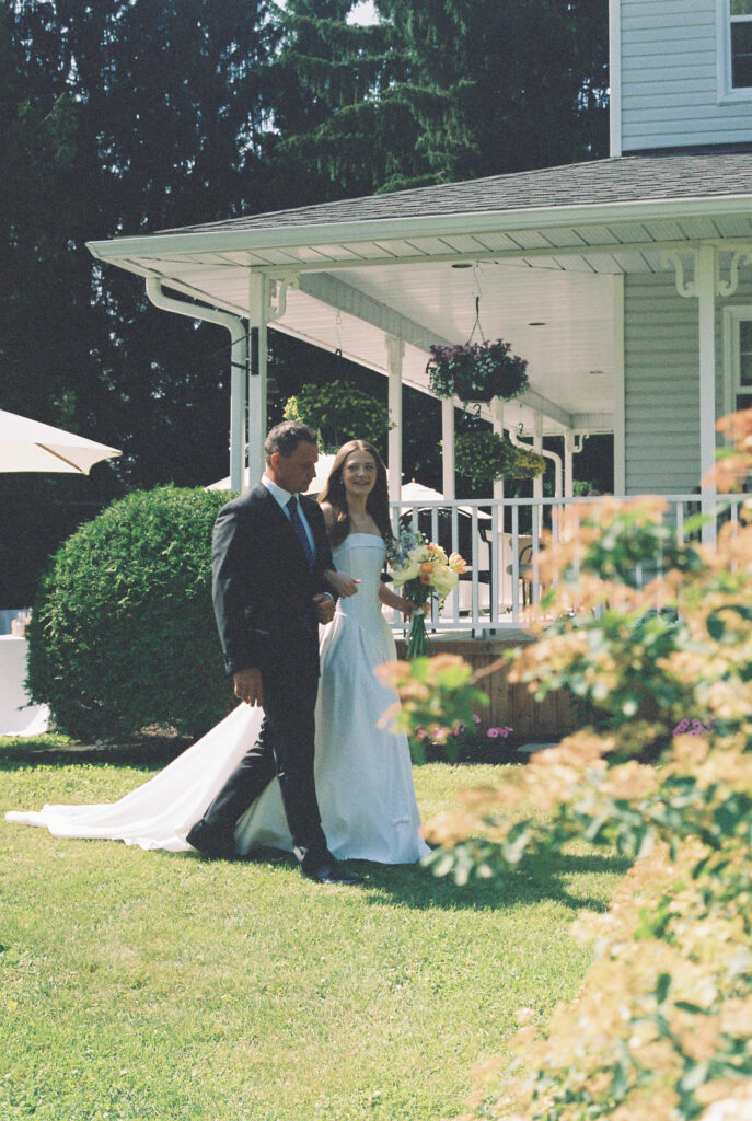 Bride walks down aisle with her father