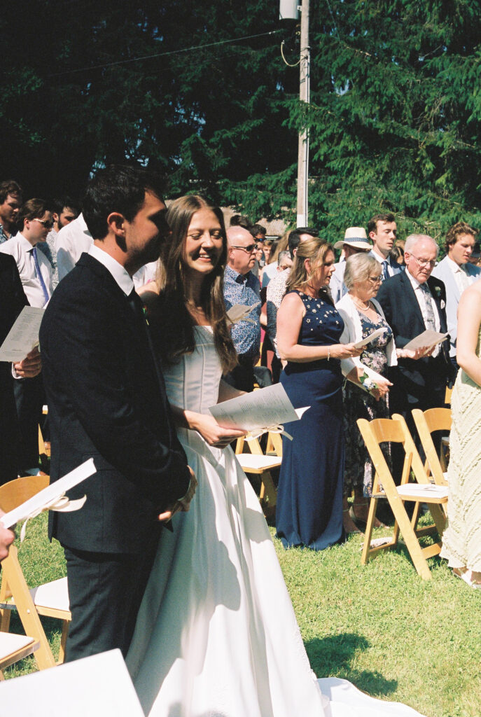 Bride and groom and guest singing. 