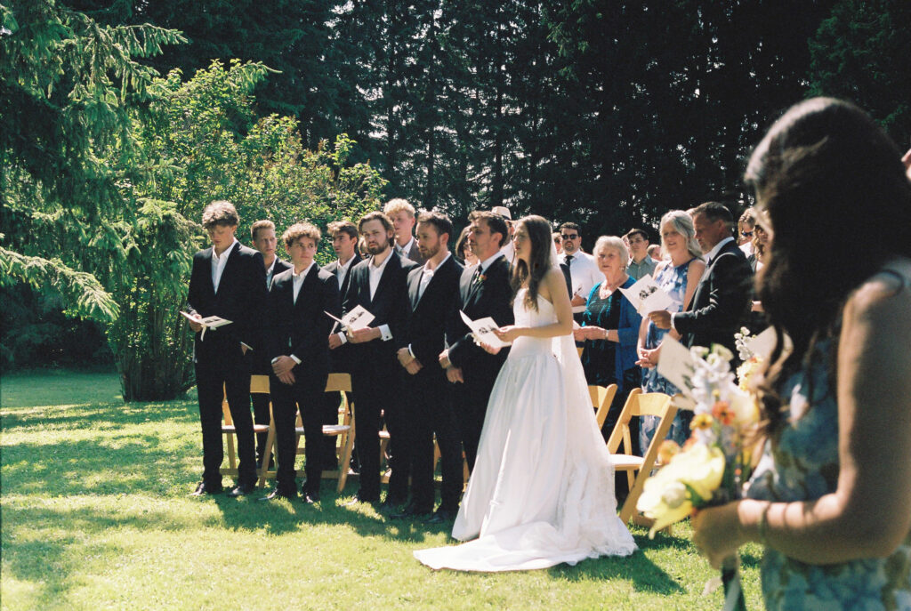 Bride and groom and guest singing. 