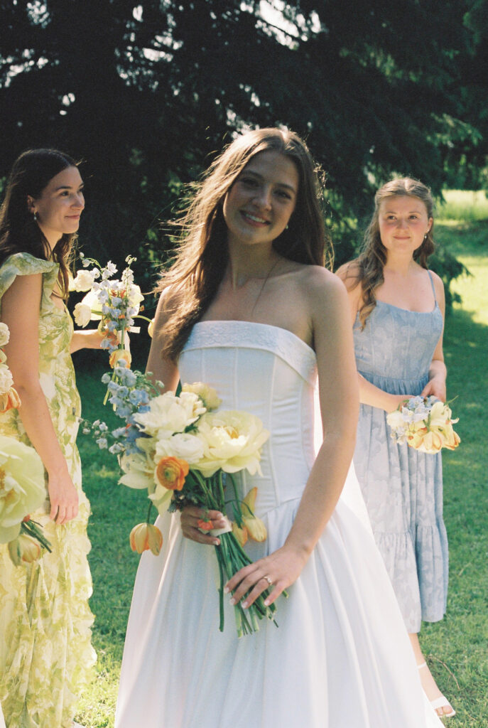 Bride holds bouquet of flowers