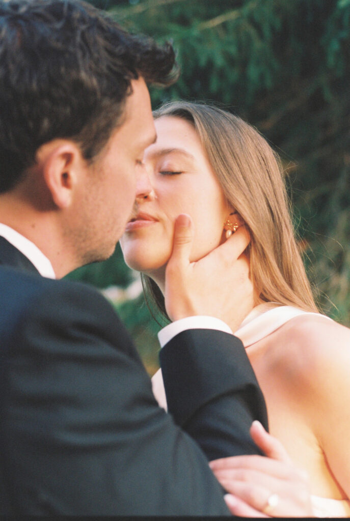 Bride and groom kiss 